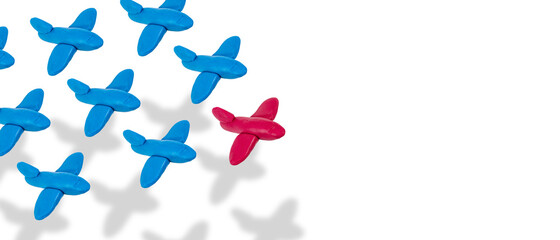 Teamwork and leadership concept, group of blue and red airplane models in isometric view on white, copy space.