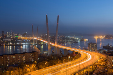 Zolotoy Bridge (Golden Bridge) at night - cable-stayed bridge over the Golden Horn Bay in Vladivostok, Russia