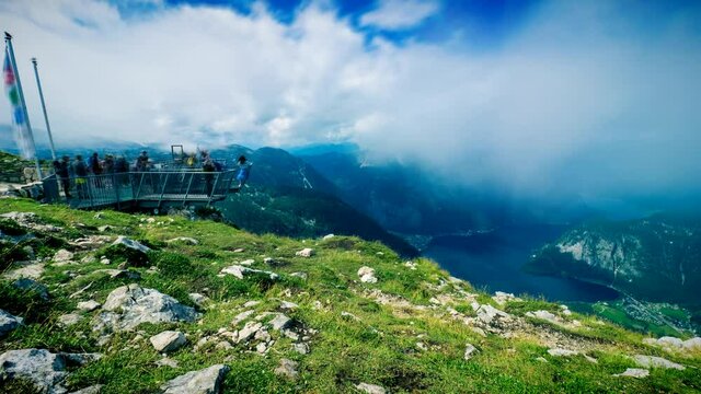 Time lapse view of clouds shrouding the 5 Fingers observation platform on top of the Krippenstein mountain, featuring a stunning view of the Salzkammergut region, OÖ, Austria