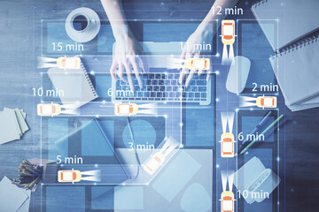 Double exposure of woman hands working on computer and car hologram drawing. Top View. Auto pilot concept.