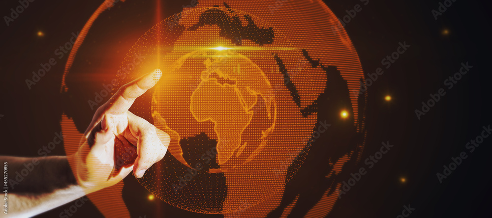 Poster hand pointing at glowing globe hologram on dark background. digital interface and global innovation.