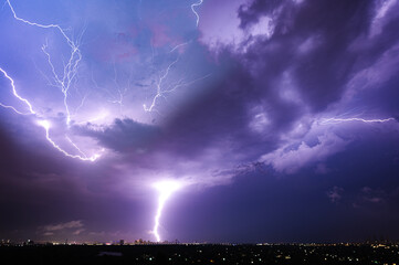 Fototapeta na wymiar Lightning strike over night city