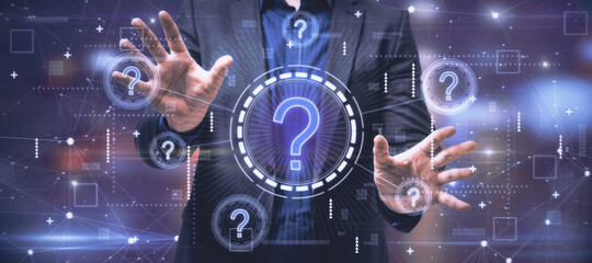Businessman hands holding creative glowing question marks interface on blurry background. Technology, business help and faq concept. - obrazy, fototapety, plakaty