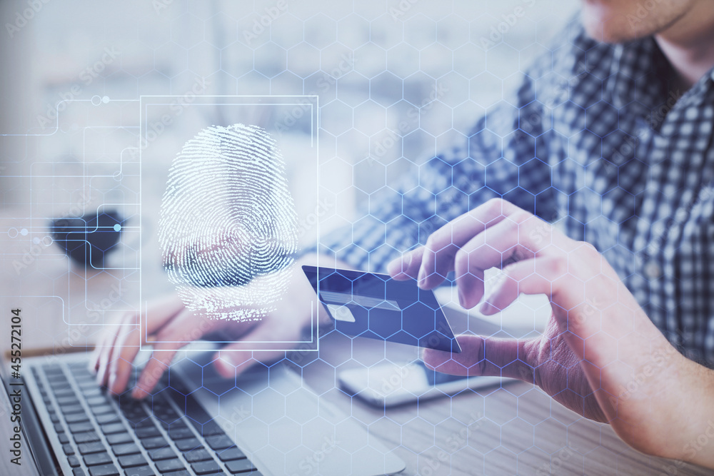 Poster double exposure of man hands holding a credit card and fingerprint drawing. security in e-commerce c