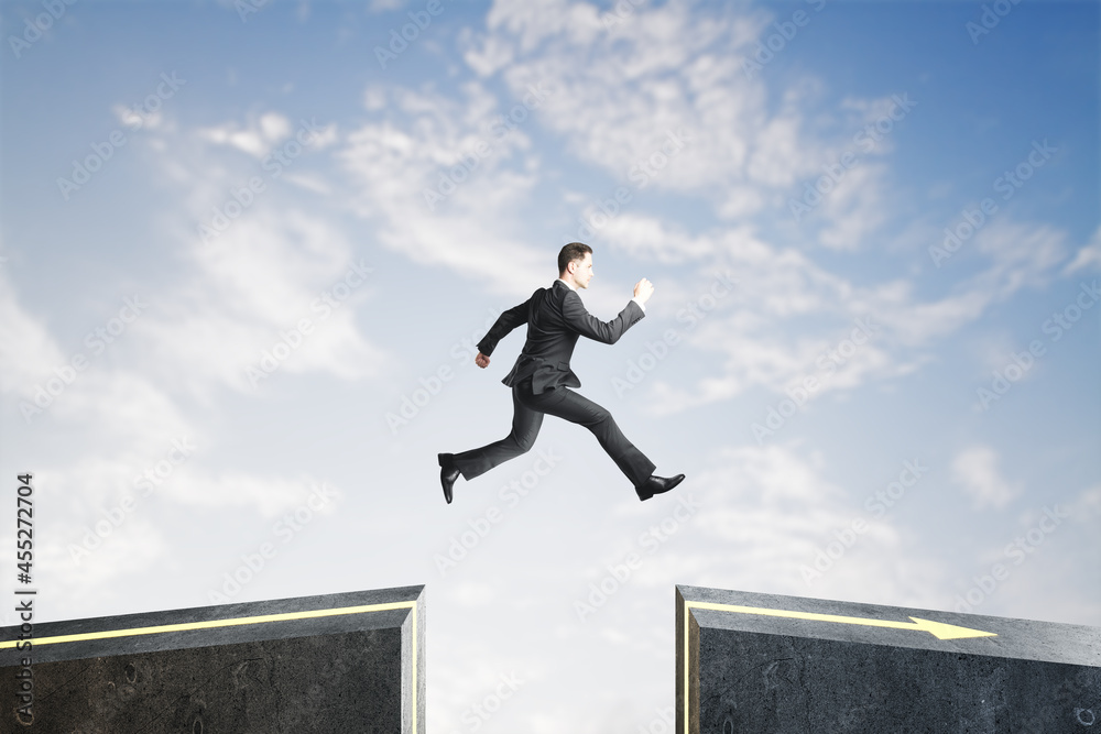 Poster Side view of businessman jumping over gap on sky background with mock up lace. Challenge and success concept.
