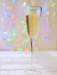 champagne on christmas lights background 
