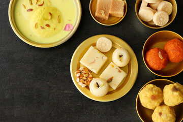 Diwali sweets pista barfi barfee Motichoor Laddu peda Rasmalai Indian sweet mithai festival dish...