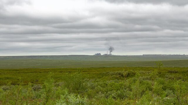 Time lapse of polluting factory in the north in tundra