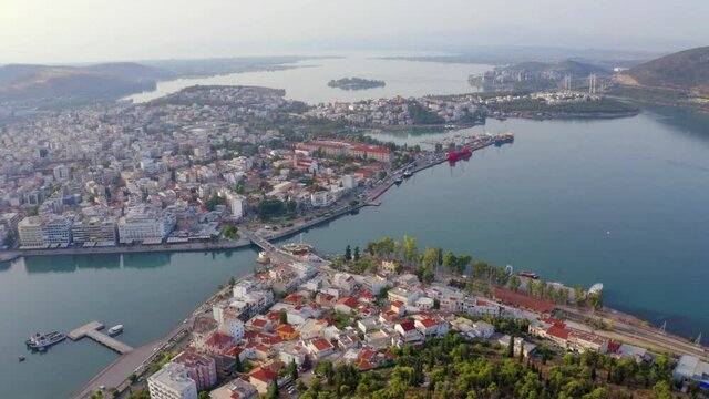 4k drone forward video (Ultra High Definition) of Chalcis town, Greece. Fantastic summer seascape of Aegean sea, North Euboean Gulf. Incredible morning scene of Euboea island, Greece, Europe.