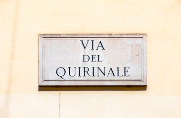 marble plate with Street name via Quirinale- engl: Quirinale street - at the wall in Rome