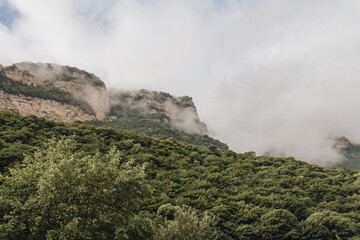 Fototapeta na wymiar Steep mountains in the fog
