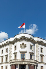 Fototapeta na wymiar flag of Hesse under blue sky at the hessian Parliament - Hessischer Landtag - in Germany, Wiesbaden
