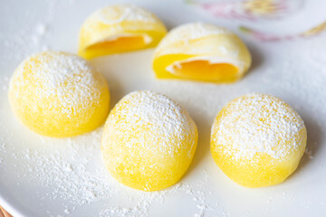 Mochi on a white plate. Yellow rice dessert, mochi is mostly Japanese traditional sweet food