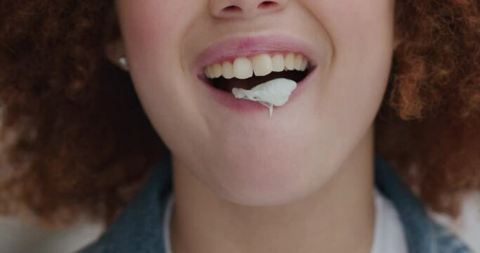 Close up portrait cute young woman blowing bubblegum