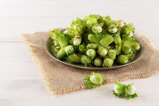 A Bunch Of Fresh Hazelnuts On An Iron Plate.