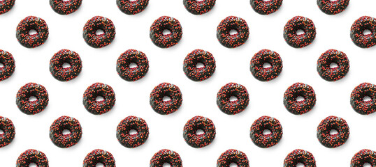 Black donuts with red glaze on white background seamless pattern top view. Food dessert flatly flat lay of delicious sweet nibbles chocolate donuts banner