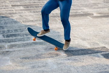 Fototapeta na wymiar Skateboarder skateboarding outdoors in city