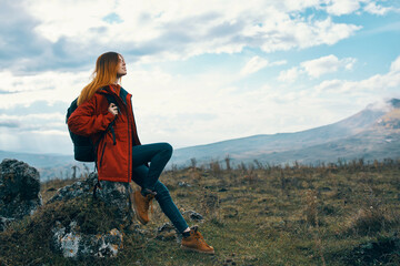 Naklejka na ściany i meble woman traveler with backpack mountains landscape freedom