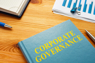Corporate governance book with business report and charts.