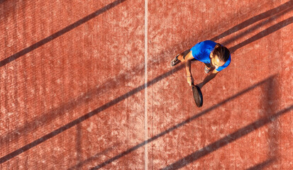 Top view of a padel player who is in his position waiting to hit the ball.