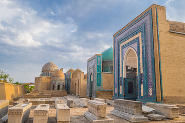 Panorama of the mausoleums of the Shakhi-Zinda complex. In the foreground are medieval gravestones. Shot in Samarkand, Uzbekistan