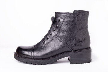 Black leather boot isolated on white background. Stylish women's shoes