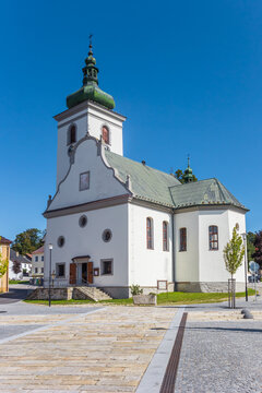Historic white church on the market square of Volary, Czech Republic
