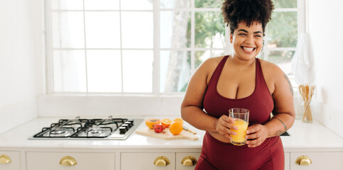 Beautiful healthy woman with glass of juice