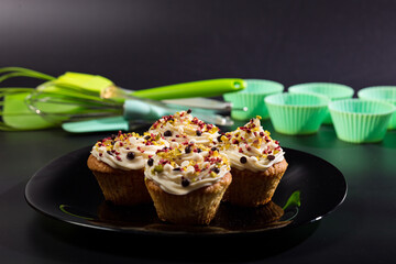 Baked muffins on plate. Just made cupcake. Pastry baking accessories.