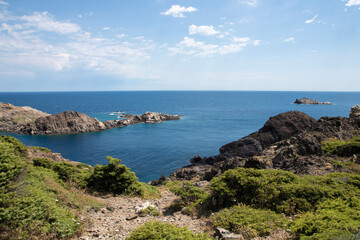 Naklejka na ściany i meble mediterranean sea coast with crystal clear water in cap de creus on the costa brava of girona