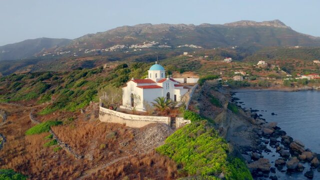4k drone flight point of view (Ultra High Definition) of Agia Paraskevi Church. Incredible evening scene of Peloponnese peninsula, Greece, Europe. Majestic summer seascape of Ionian sea..