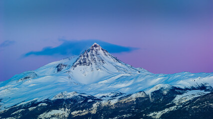 Snow covered mountain in the blue hour before sunrise in Patagonia, Chile