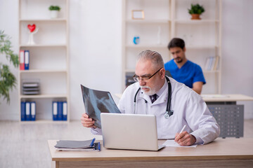 Two male doctors radiologists working in the clinic