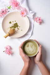 Fototapeta na wymiar Matcha green tea latte in a bowl. Matcha is a powder of green tea leaves packed with antioxidants.