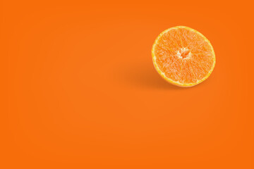 Orange fruit on orange color background for copy space