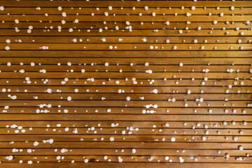 Background of wooden sticks with small round snowballs
