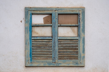 Fototapeta na wymiar Brazilian colonial house window in a white wall