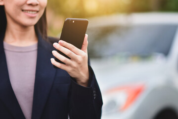 Closeup businesswomen using smartphone call phone