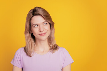Fototapeta premium Portrait of dreamy inspired lady look blank space think thoughts on yellow background