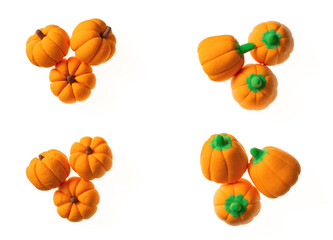 Pumpkin candies isolated on white background, top view