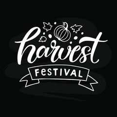 Harvest festival illustration with lettering, leaves, pumpkin isolated on black background. Autumn time concept for season's greeting, cards, harvest fest poster, banner, logo, tags.