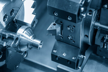 The  CNC lathe machine thread cutting at the end metal cone shape parts. - obrazy, fototapety, plakaty