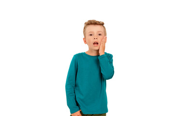 Photo of a child on a white isolated background showing with a gesture of his hand pressed to his cheek that he has a toothache.