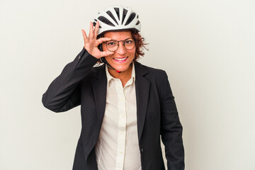 Middle age latin business woman wearing a bike helmet isolated on white background excited keeping ok gesture on eye.