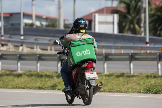 Delivery service man ride a Motercycle of Grab Food
