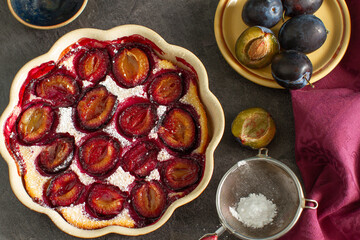 Rustic homemade plum clafoutis on a table