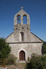 Fototapeta na wymiar Façade de la vielle église du village de Gras an Ardèche méridionale