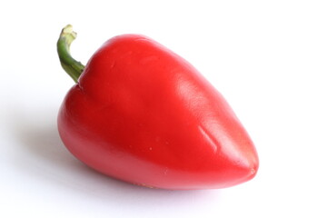 Red bell pepper on a light background. 