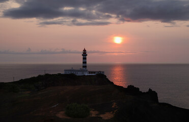 Fototapeta premium Sunset at the lighthouse of Ponta da Barca, Graciosa island, Azores
