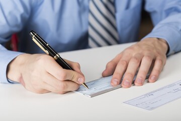 Businessman Writing a Cheque